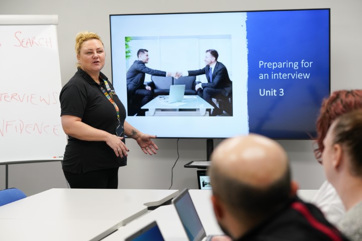 A Workshop Trainer presenting to group